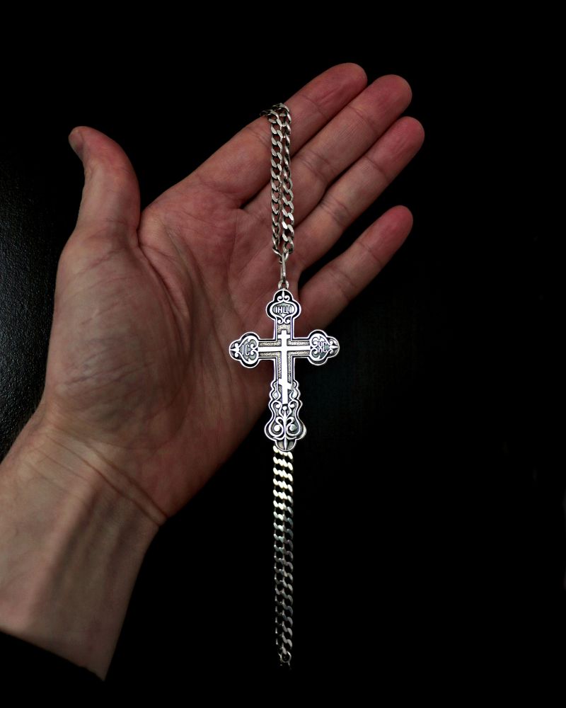 Men cross with chain